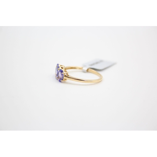 29 - 18ct gold tanzanite trilogy ring 2.9 grams gross