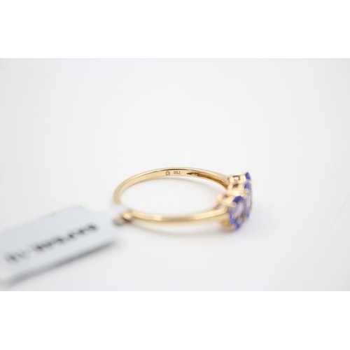 29 - 18ct gold tanzanite trilogy ring 2.9 grams gross