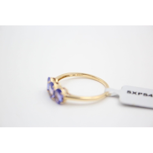 29 - 18ct gold tanzanite trilogy ring 2.9 grams gross