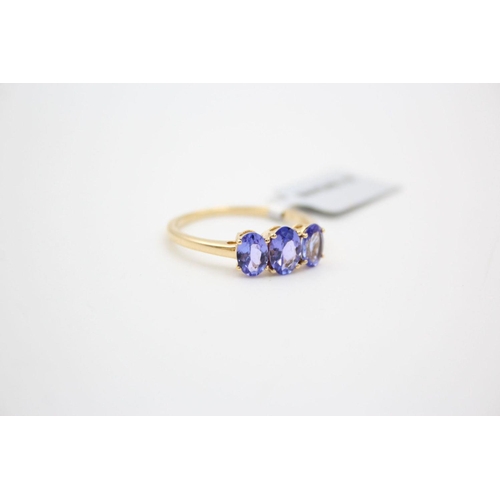 29 - 18ct gold tanzanite trilogy ring 2.9 grams gross