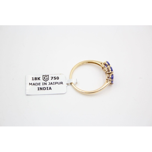 29 - 18ct gold tanzanite trilogy ring 2.9 grams gross