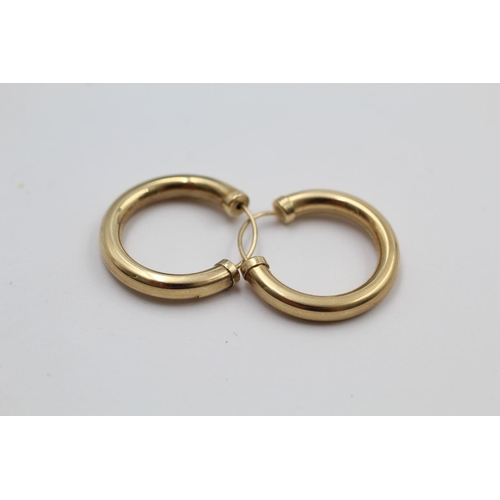 307 - 2 x 9ct gold hoop earrings 2 grams gross