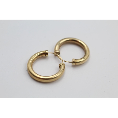 307 - 2 x 9ct gold hoop earrings 2 grams gross