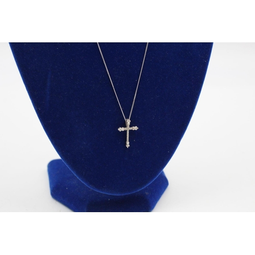 322 - 18ct white gold diamond cross pendant 9ct chain 2 grams gross