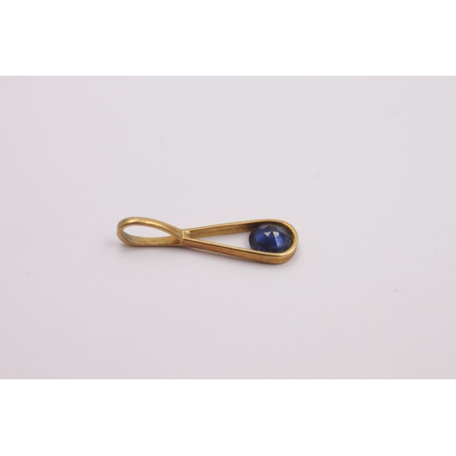 362 - 18ct Gold sapphire pendant 0.3 grams gross