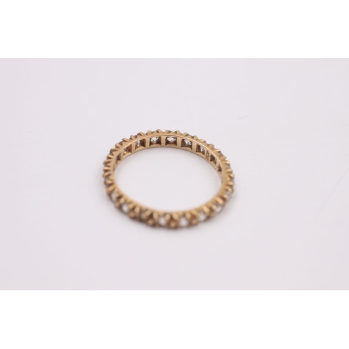 376 - 9ct Gold gemstone eternity ring 1.4 grams gross