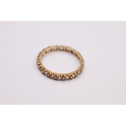 376 - 9ct Gold gemstone eternity ring 1.4 grams gross