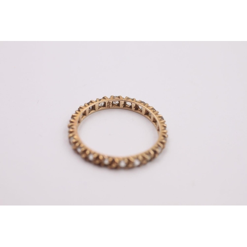 376 - 9ct Gold gemstone eternity ring 1.4 grams gross