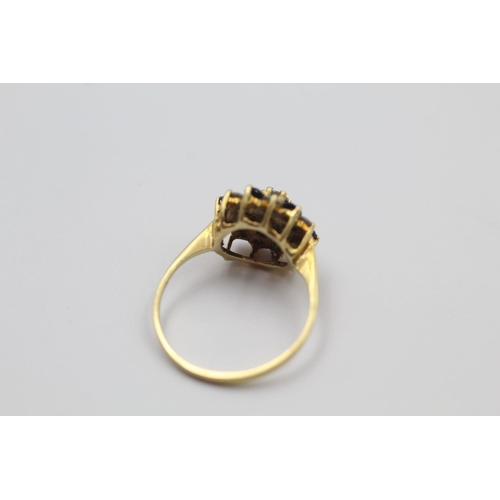 384 - 18ct Gold gemstone cluster ring 3.1 grams gross