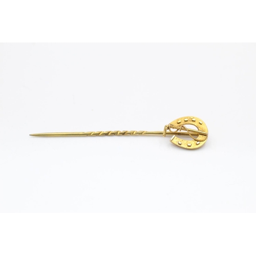 391 - 18ct gold antique horseshoe stick pin 1.5 grams gross