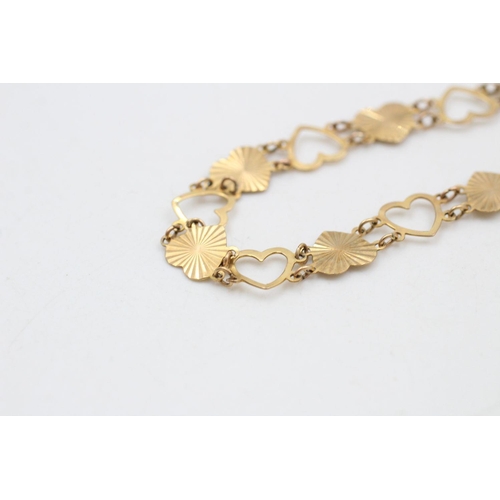 397 - 9ct gold love heart bracelet 3.6 grams gross