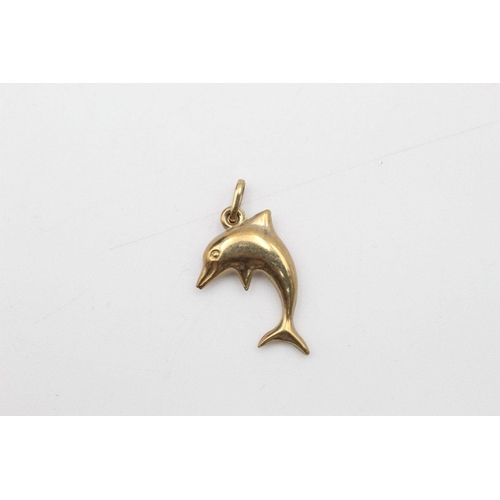 63 - 2 x 9ct gold dolphin pendants 1.1 grams gross