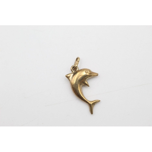 63 - 2 x 9ct gold dolphin pendants 1.1 grams gross