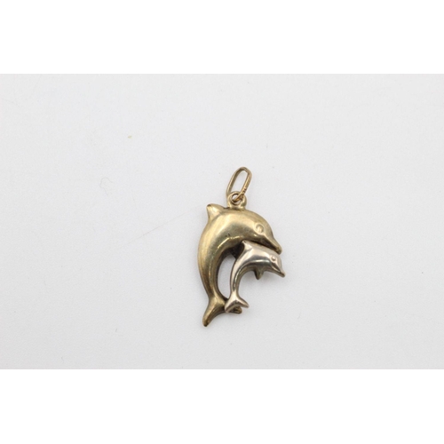 63 - 2 x 9ct gold dolphin pendants 1.1 grams gross