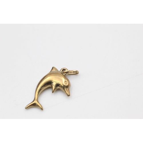 63 - 2 x 9ct gold dolphin pendants 1.1 grams gross