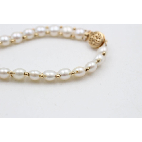 67 - 14ct gold and pearl bracelet 10 grams gross