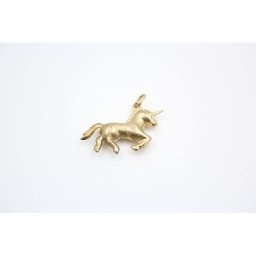 92 - 3 x 9ct gold dolphin and unicorn pendants 1.5 grams gross