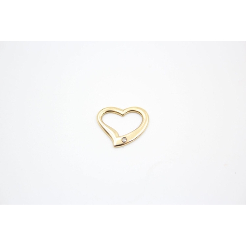 93 - 4 x 9ct gold heart pendants 2.4 grams gross