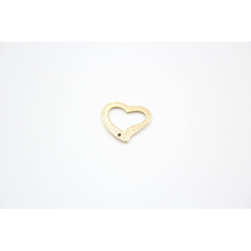 93 - 4 x 9ct gold heart pendants 2.4 grams gross