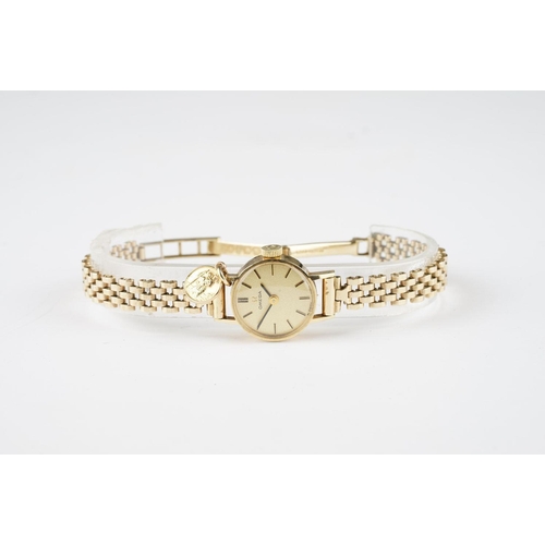 158 - LADIES OMEGA 9CT GOLD COCKTAIL WATCH W/ PENDANT, circular champagne dial with stick hour markers and... 