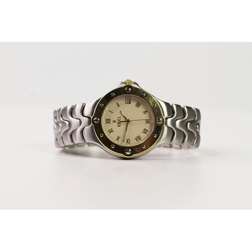 174 - EBEL STEEL AND GOLD WRIST WATCH, circular cream dial with roman numeral hour markers, date function ... 