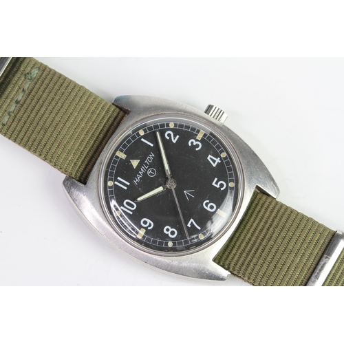 31 - HAMILTON MILITARY W10 WATCH 1979, black dial with Arabic numerals, outer minute track, crows foot an... 