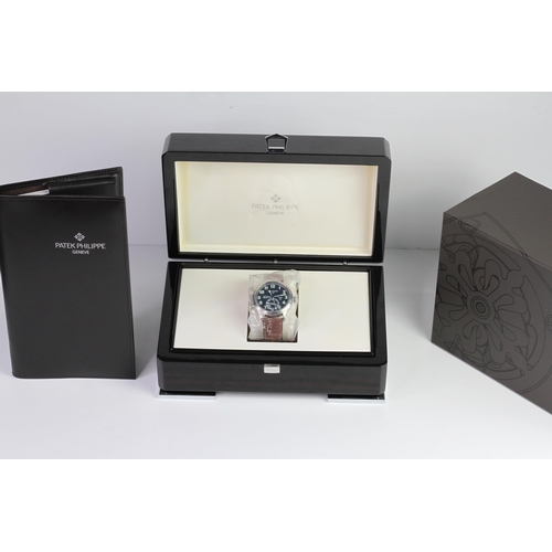 55 - A FINE PATEK PHILIPPE CALATRAVA PILOT TRAVEL TIME REFERENCE 5224G-001, SEALED FROM SERVICE, WITH BOX... 