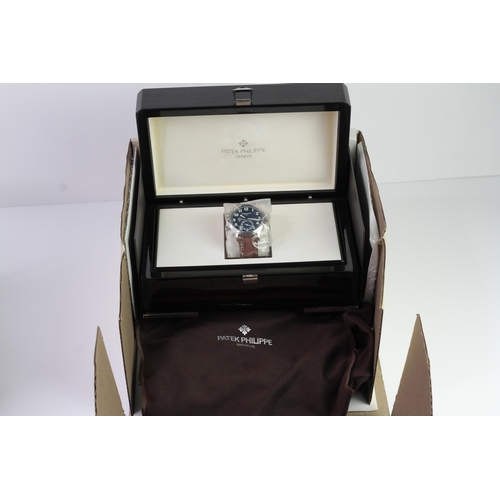 55 - A FINE PATEK PHILIPPE CALATRAVA PILOT TRAVEL TIME REFERENCE 5224G-001, SEALED FROM SERVICE, WITH BOX... 