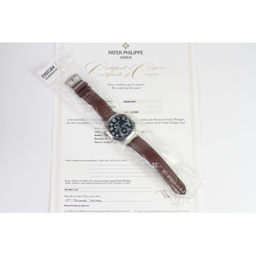 55 - A FINE PATEK PHILIPPE CALATRAVA PILOT TRAVEL TIME REFERENCE 5224G-001, SEALED FROM SERVICE, WITH BOX... 