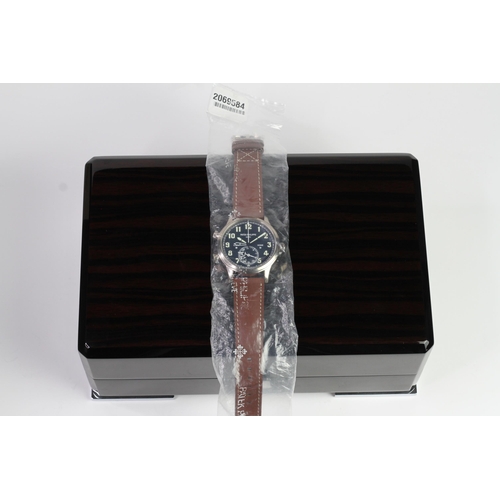 55 - A FINE PATEK PHILIPPE CALATRAVA PILOT TRAVEL TIME REFERENCE 5224G-001, SEALED FROM SERVICE, WITH BOX... 