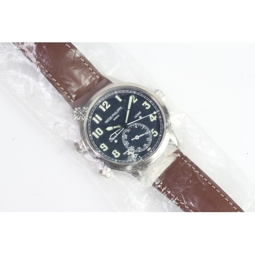 55 - A FINE PATEK PHILIPPE CALATRAVA PILOT TRAVEL TIME REFERENCE 5224G-001, SEALED FROM SERVICE, WITH BOX... 