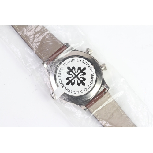 55 - A FINE PATEK PHILIPPE CALATRAVA PILOT TRAVEL TIME REFERENCE 5224G-001, SEALED FROM SERVICE, WITH BOX... 