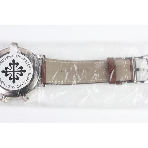 55 - A FINE PATEK PHILIPPE CALATRAVA PILOT TRAVEL TIME REFERENCE 5224G-001, SEALED FROM SERVICE, WITH BOX... 