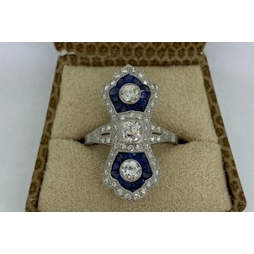 810 - Platinum up the finger sapphire and diamond ring with calibre set sapphires in each fan 3 RB bezel s... 