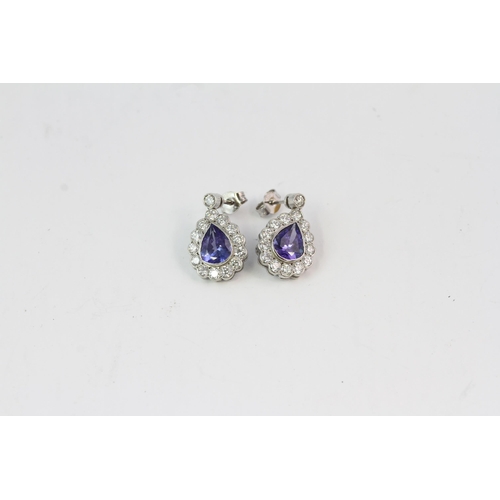 821 - 18WG Tanzanite and diamond cluster drop earrings, pear shaped. TZ 3.10 D1.60