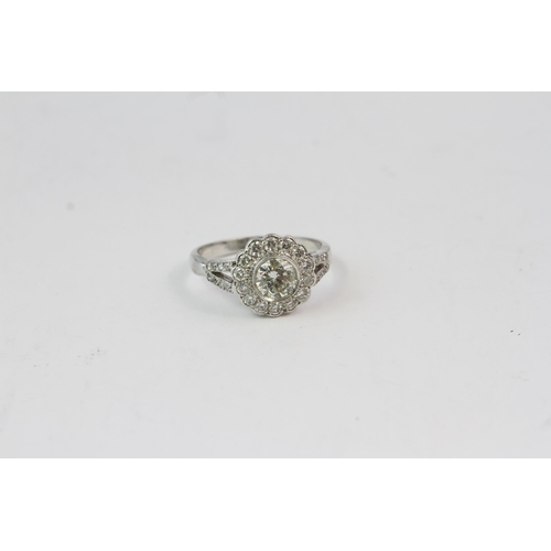 827 - 18WG flower shaped diamond cluster ring with split diamond shoulders Central diamond 1ct with 0.60ct