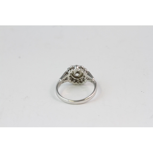 827 - 18WG flower shaped diamond cluster ring with split diamond shoulders Central diamond 1ct with 0.60ct