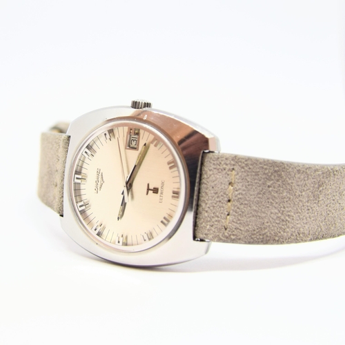 186 - LONGINES LARGE ULTRASONIC DATE TONNEAU WRISTWATCH MODEL 8479 IN STAINLESS STEEL CASE WITH BOX 1976. ... 