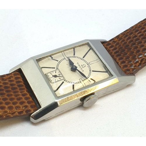 200 - OMEGA DECO STYLE TANK WRISTWATCH CALIBER 20F IN STAINLESS STEEL CASE CIRCA 1934 WITH SUNRISE DIAL. S... 