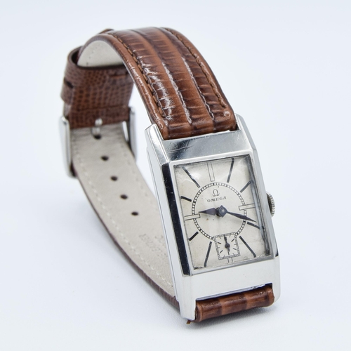 200 - OMEGA DECO STYLE TANK WRISTWATCH CALIBER 20F IN STAINLESS STEEL CASE CIRCA 1934 WITH SUNRISE DIAL. S... 