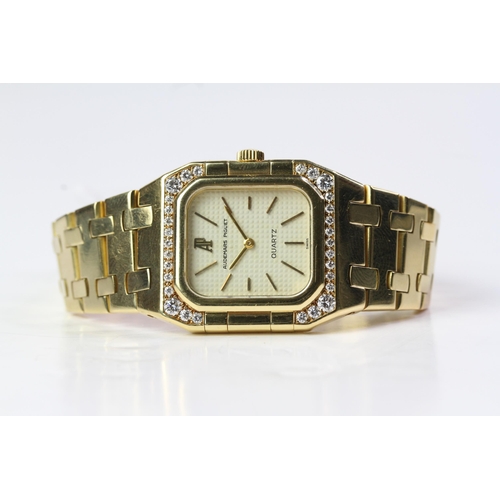 308 - LADIES 18CT AUDEMARS PIGUET DIAMOND SET QUARTZ,  rectangular waffle dial, 25mm 18ct gold case with d... 