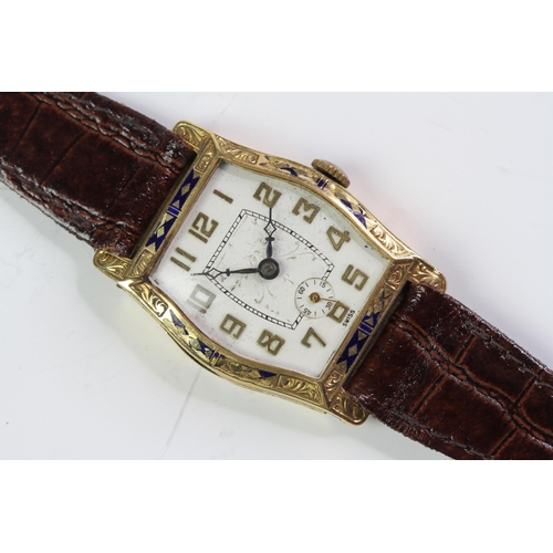 344 - Art Deco 18ct enamel bezel watch, Tonneau shape engraved dial, with gilt Arabic numerals. Engraved c... 