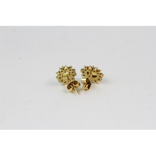 851 - 18YG yellow sapphire and diamond cluster earrings. Hallmarked 18ct