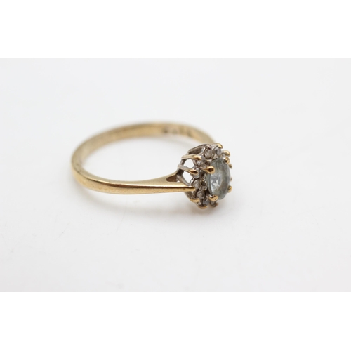 614 - 9ct gold aquamarine & diamond halo ring (2.3g)