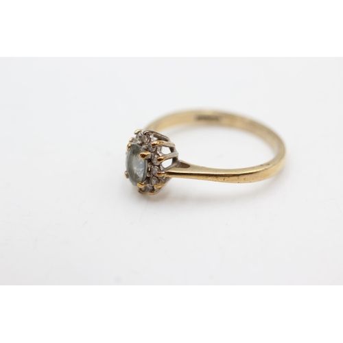 614 - 9ct gold aquamarine & diamond halo ring (2.3g)