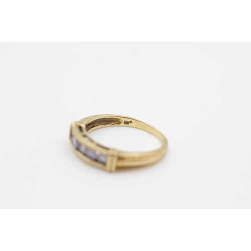 616 - 9ct gold tanzanite channel setting ring (2.7g)