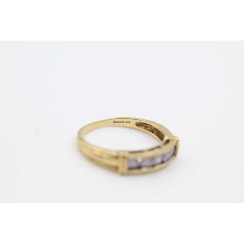 616 - 9ct gold tanzanite channel setting ring (2.7g)