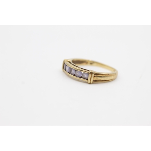 616 - 9ct gold tanzanite channel setting ring (2.7g)