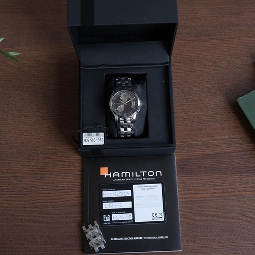 148 - GENTLEMAN'S HAMILTON JAZZMASTER OPEN HEART, H32565135, JULY 2018 BOX & PAPERS, circular black and op... 