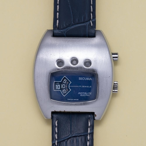 154 - GENTLEMAN'S SICURA ISNTALITE ELECTRIC JUMP HOUR BLUE DIAL, CIRCA. 1970S, rectangular blue dial with ... 